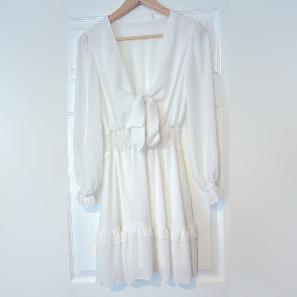 Size small white ruffled dress. Like-new, gently worn once.
